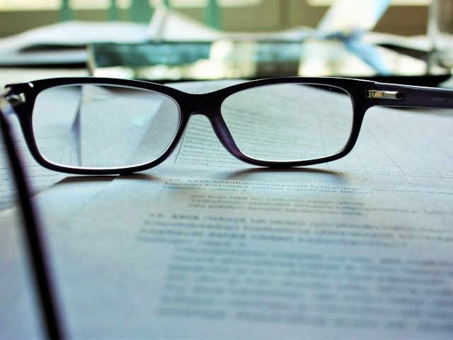 Reading glasses on a document.