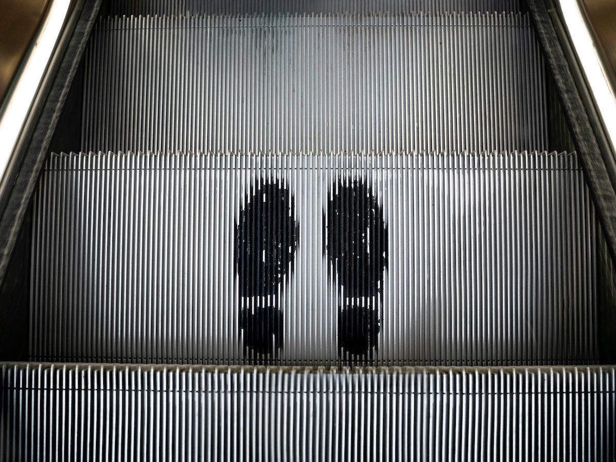 graphic of shoes on an escalator