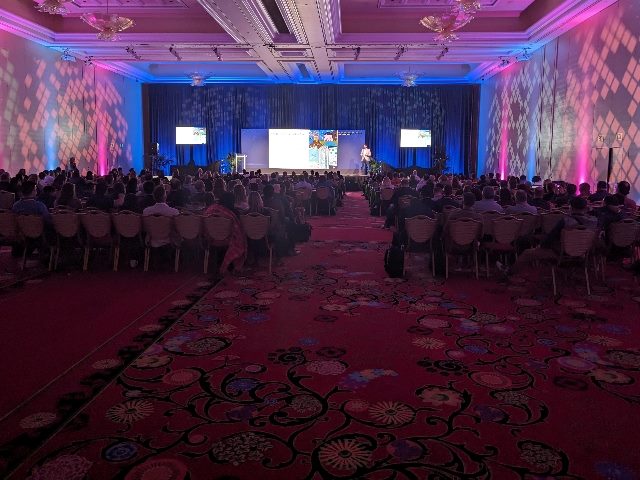 Acquia Engage attendees listen to a keynote from Paul Roetzer on AI in marketing at the Encore Casino in Everett, Mass. Tuesday, Nov. 14.