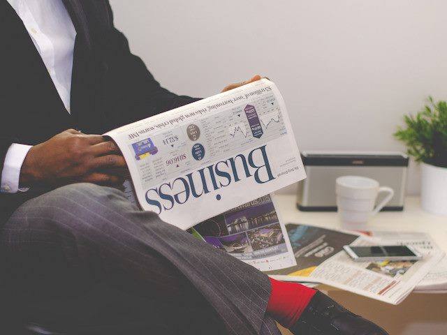 man reading the business papers