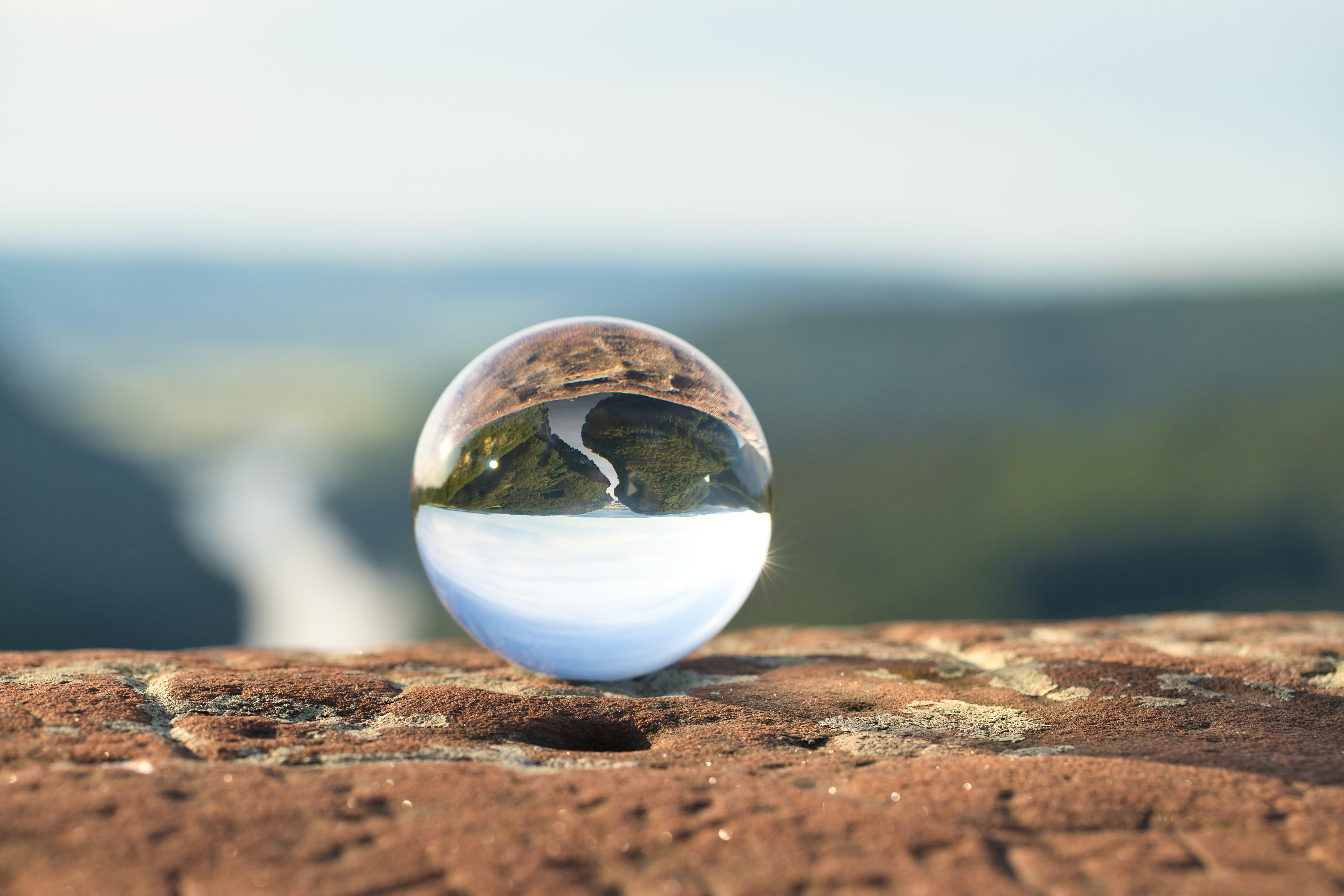 Crystal ball on ledge in nature