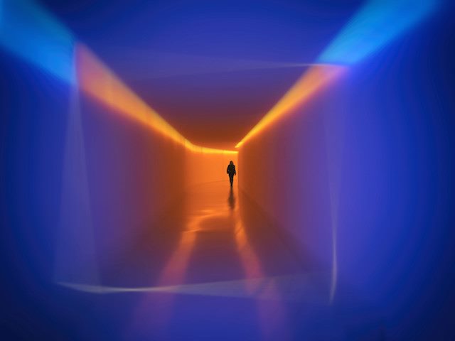 walking in a room with colored lights