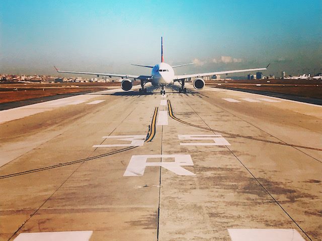 plane on the tarmac, readying for lift off