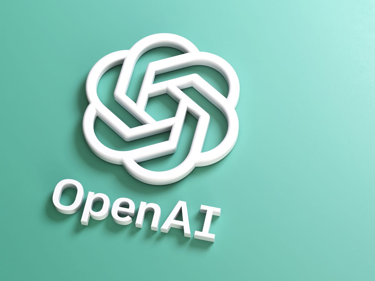 The OpenAI logo on a plain turquoise background