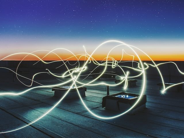 time lapse of light movement at night on a rooftop