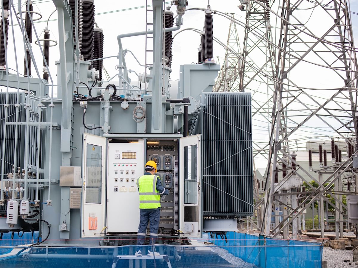 man with hardhat on working on the frontline on energy infrastructure