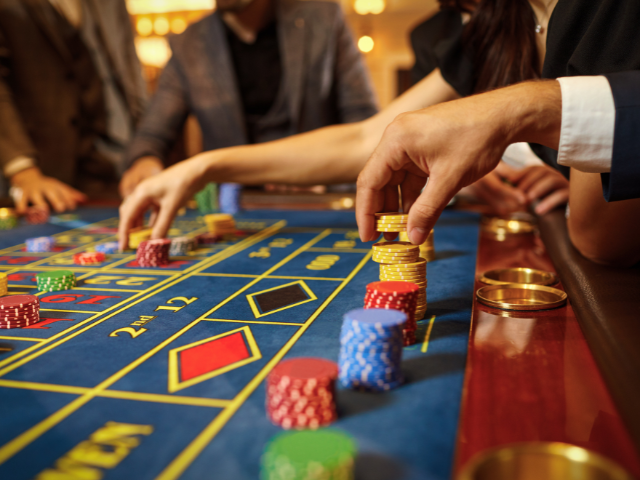 A group of people gambling 