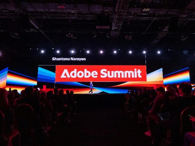Adobe CEO Shantanu Narayen on stage at the Adobe Summit during a keynote address.