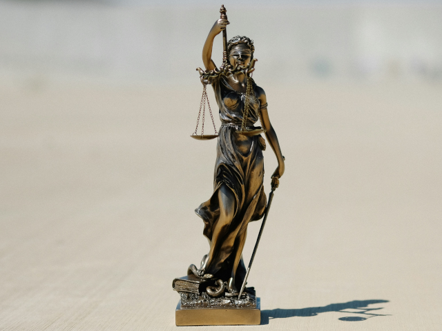 A statue of blind justice and scales.