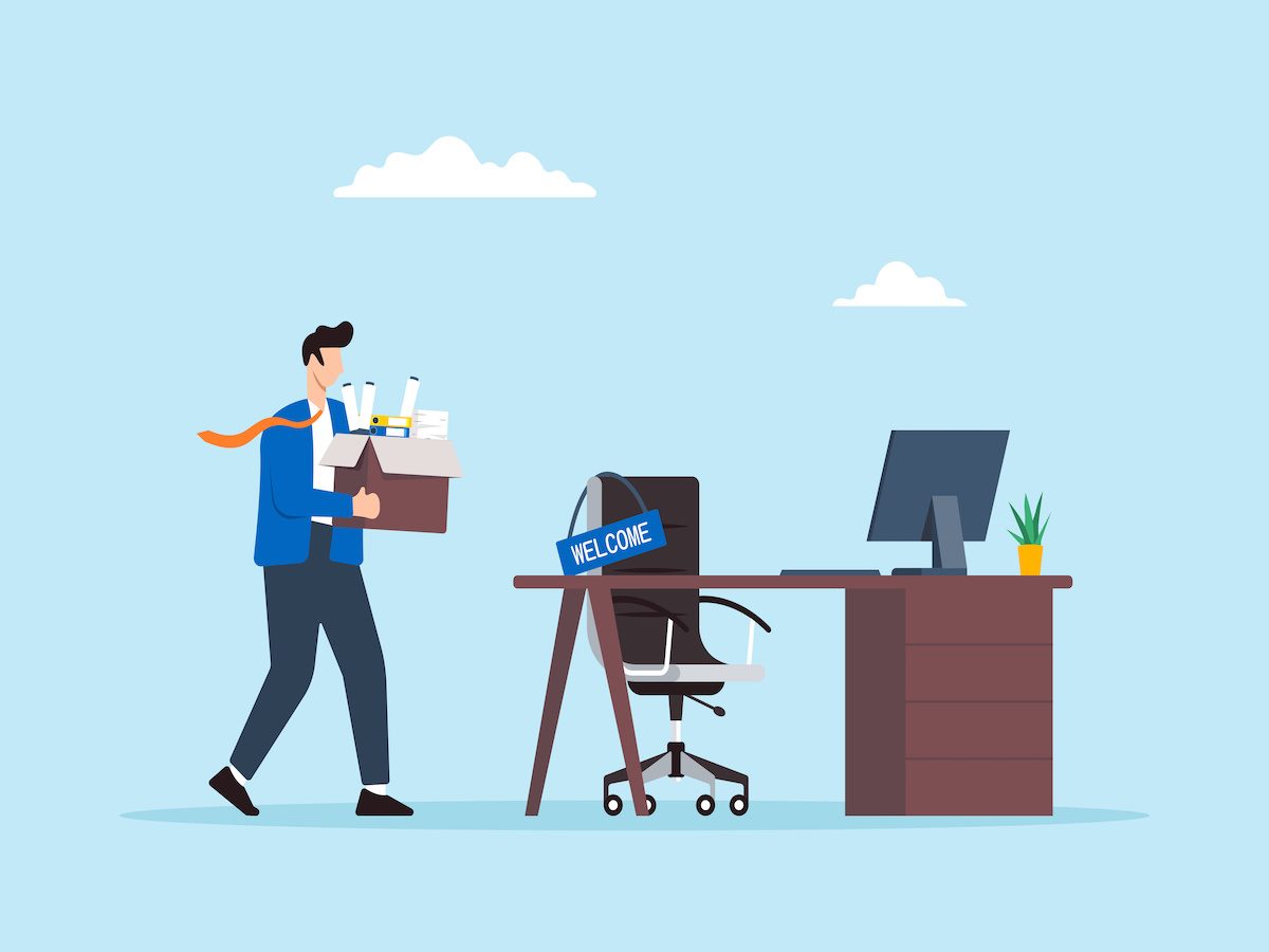 An illustration of a business person holding a box of their personal items walking into an office
