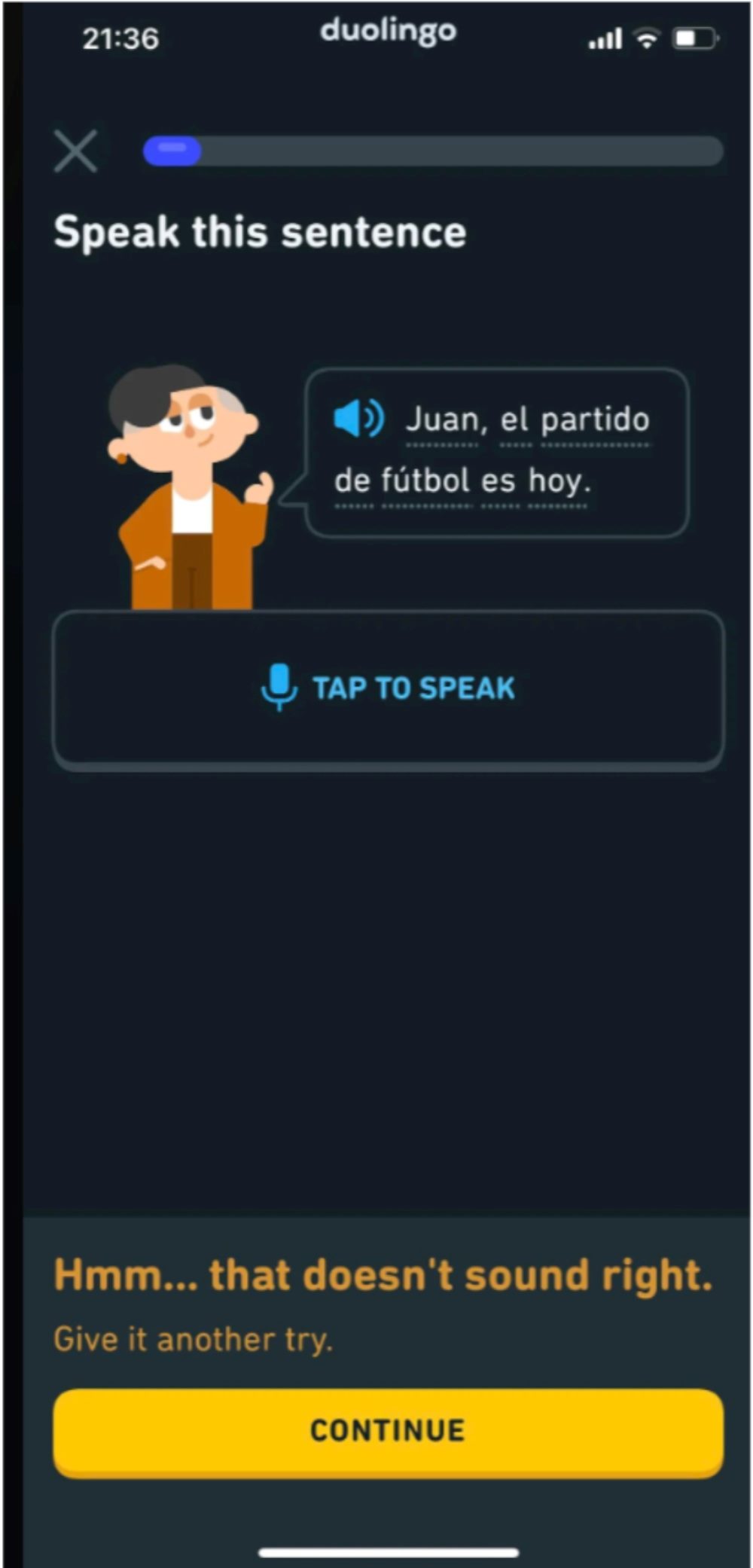 Screenshot from the Duolingo app showing a speaking exercise with the prompt “Speak this sentence” and the phrase “Juan, el partido de fútbol es hoy.” A microphone button invites the user to “Tap to speak,” and a feedback message below reads “Hmm… that doesn’t sound right. Give it another try.”