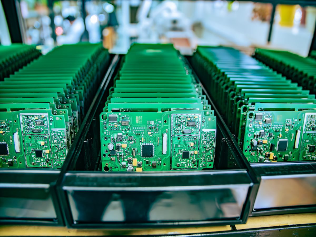 Electronic Circuit Boards Stacked on Workbench