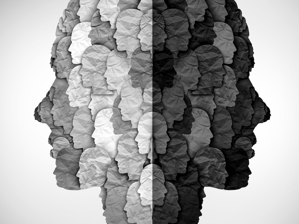 Illustration of two faces made up of other faces