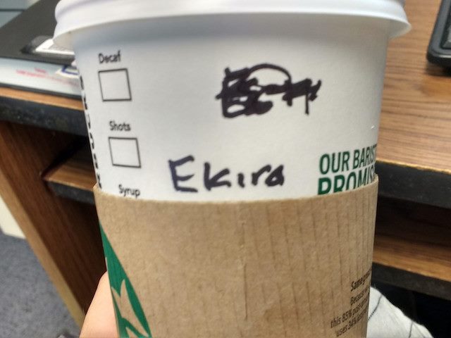 Starbucks cup with multiple name misspellings