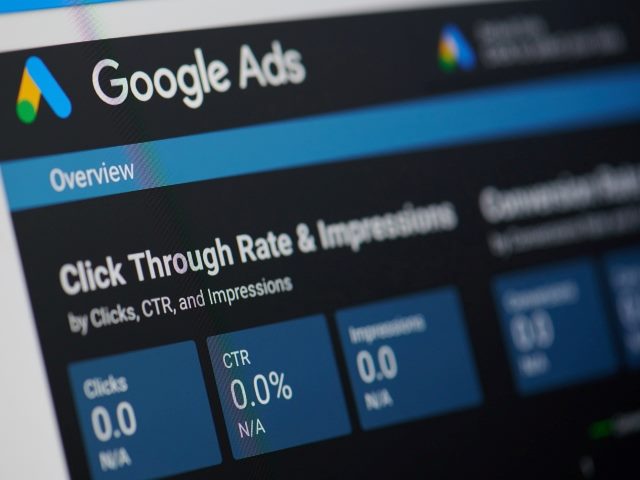 A computer monitor displays the Google ads menu