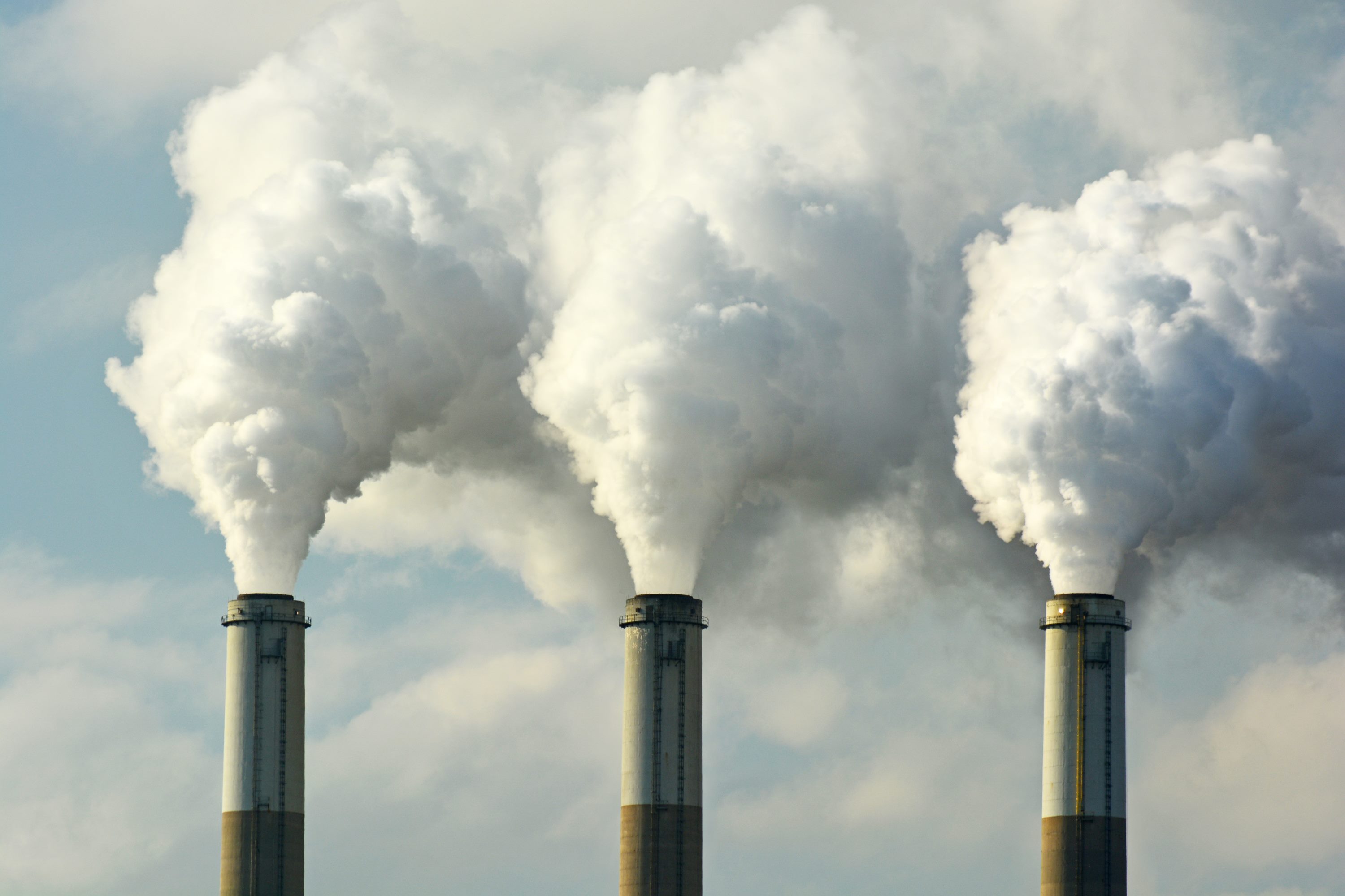 Multiple Coal Fossil Fuel Power Plant Smokestacks