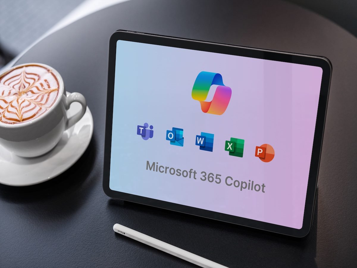 Microsoft 365 copilot displaying on tablet with coffee and pen