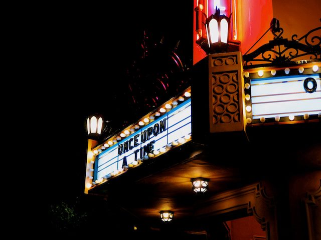 movie marquee lit up at night reading "once upon a time"