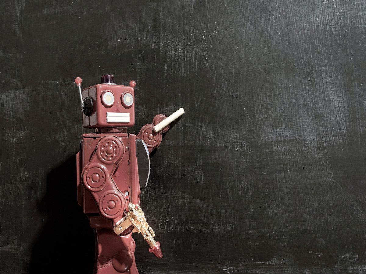 A robot teacher at a blackboard