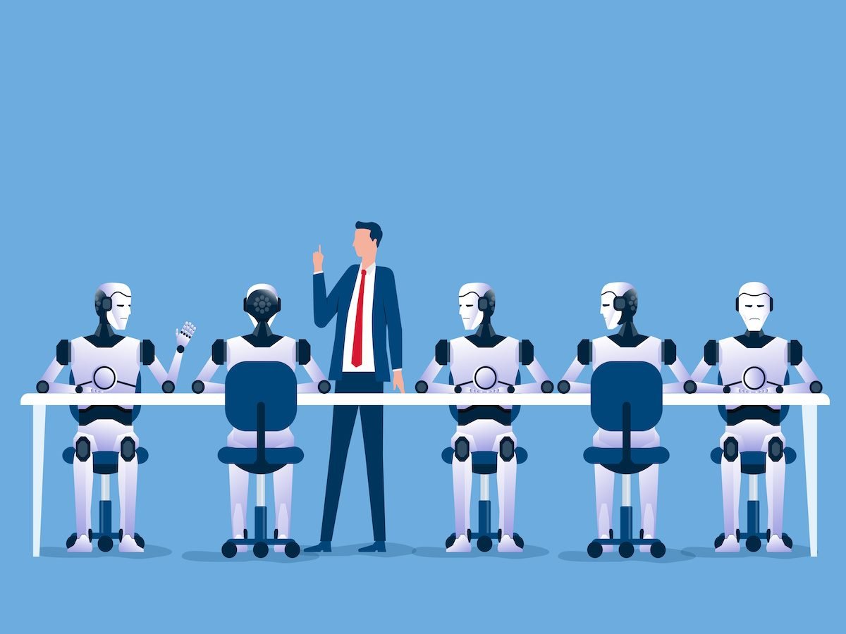 A group of robots sitting at a table with a businessman standing nearby