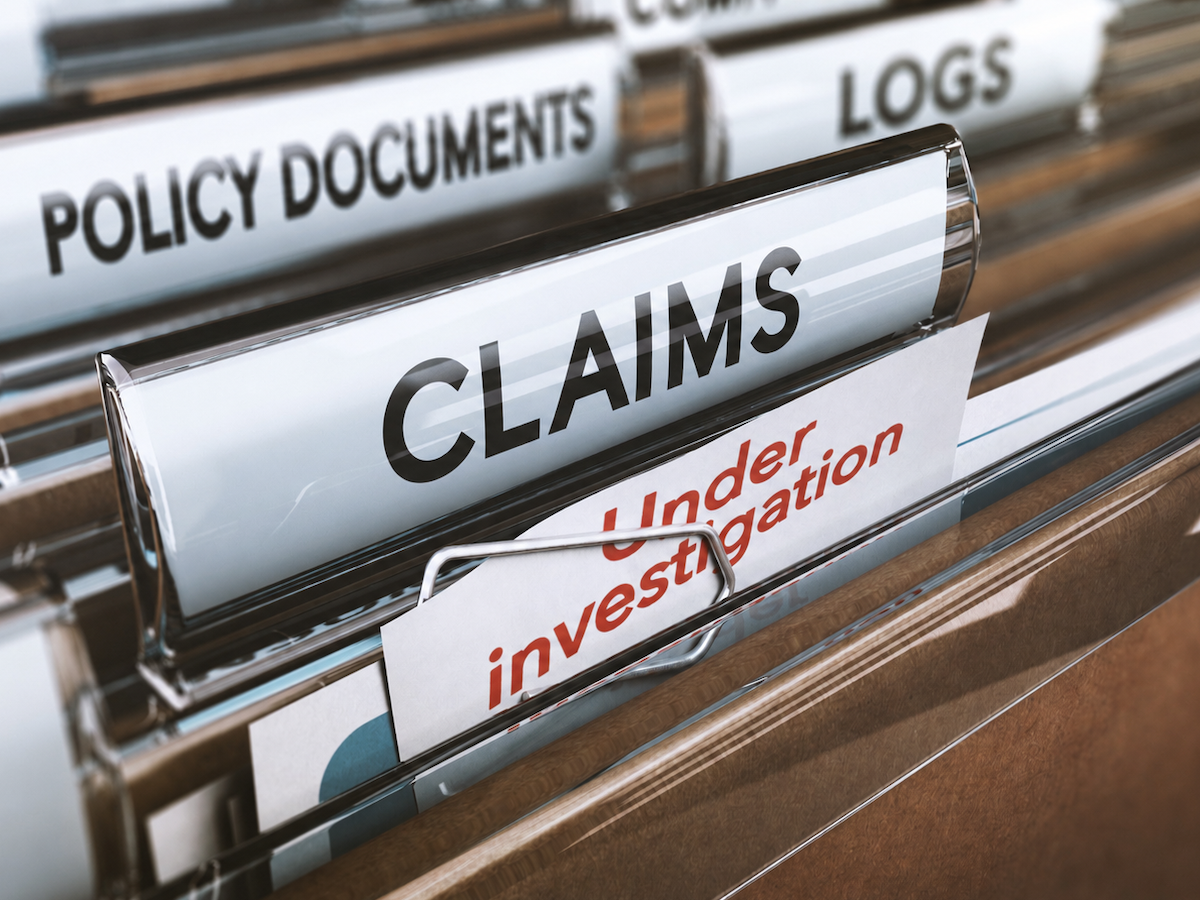 Insurance company folders, with tabs like "Claims" and "Policy Documents"