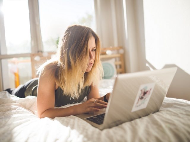 Young woman shopping online. 