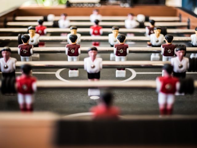 A closeup shot of a foosball table