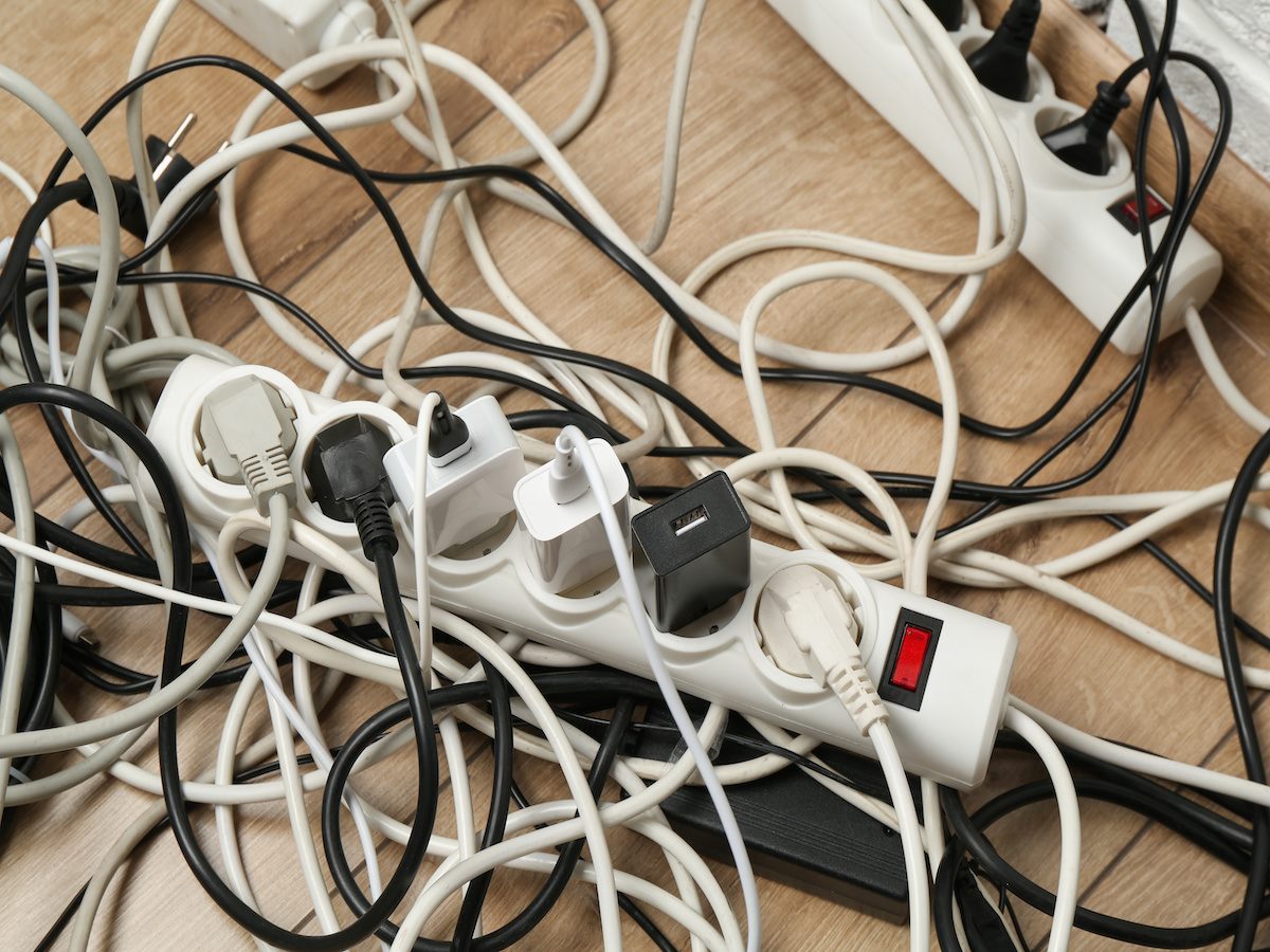 Multiple cords plugged into outlets 
