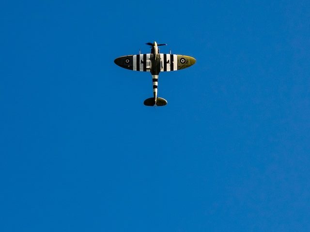 historical old plane flying straight up into the sky