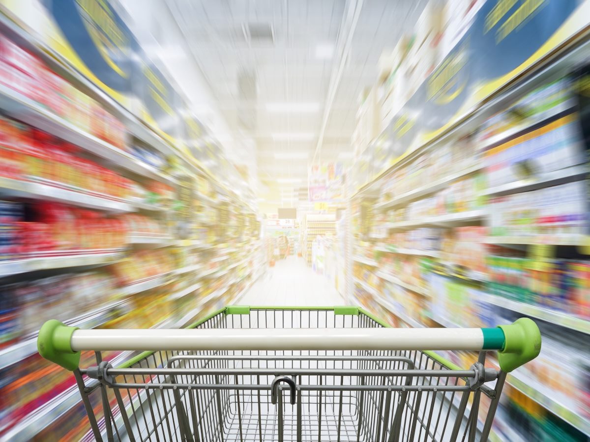 A shopping cart in a store aisle